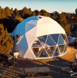 Geodesic dome structure with transparent walls in a natural setting